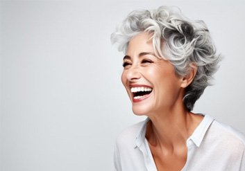 a woman smiling with bright and beautiful teeth