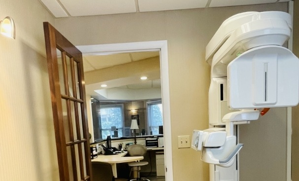 Cone beam scanner next to door to hallway of periodontal office