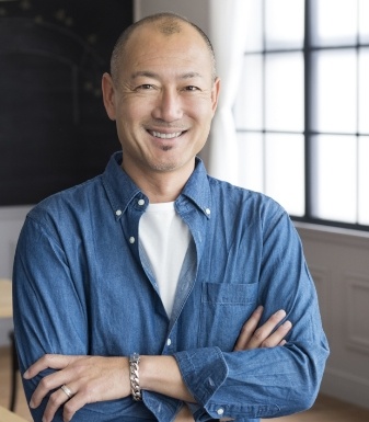 Smiling man in denim shirt